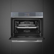 Компактный духовой шкаф с пароваркой Smeg SF4104WVCPS фото 4 в Санкт-Петербурге