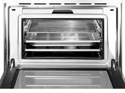 Компактный духовой шкаф с пароваркой Smeg SF4750VCBS фото 3 в Санкт-Петербурге